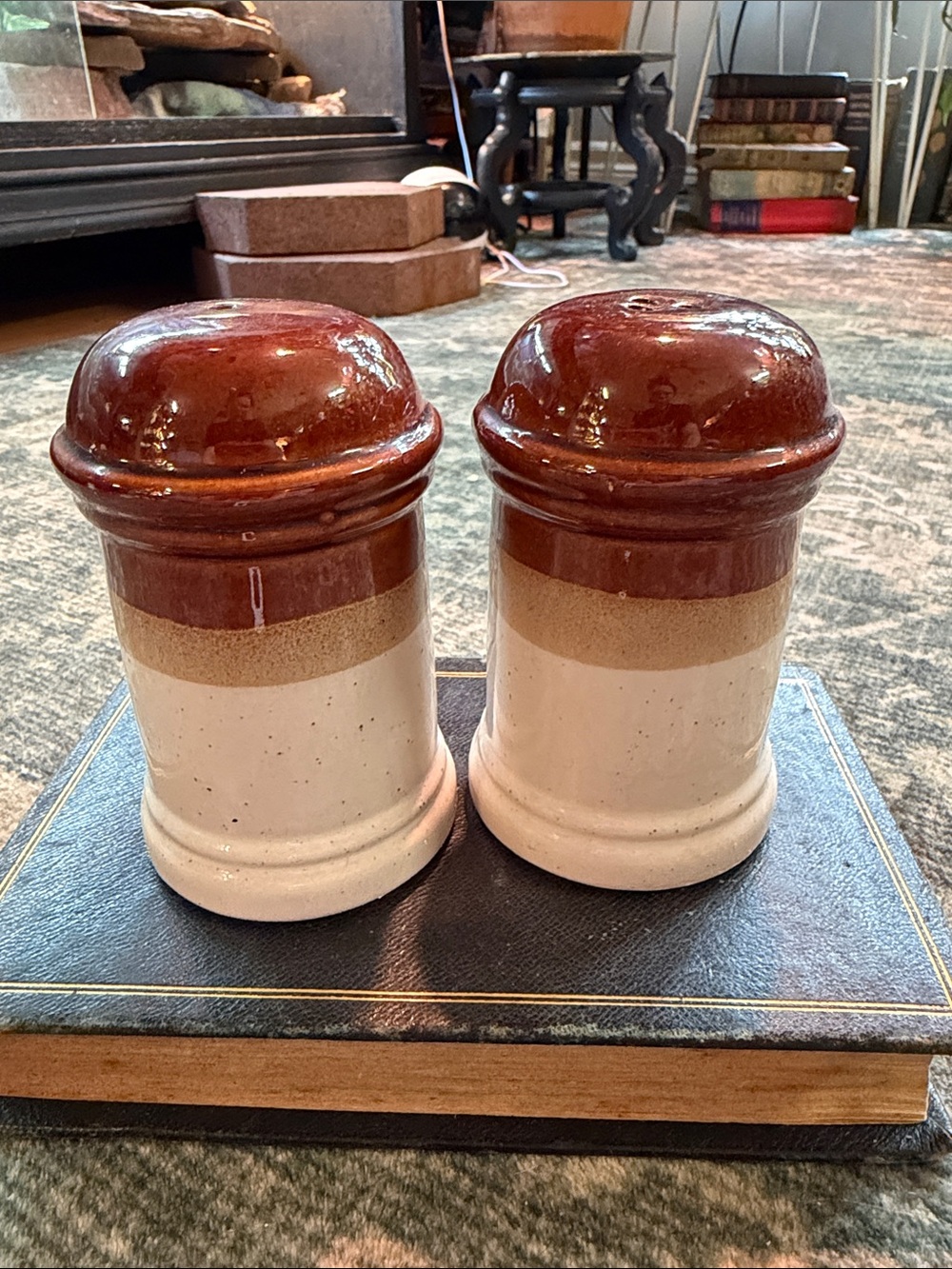 Vintage multi-tone brown stoneware salt and pepper shakers.
